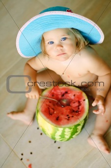 girl eats a dessert water-melon with a spoon