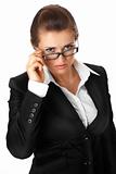 modern business woman straightening eyeglasses