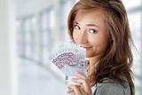 Woman holding euros bills
