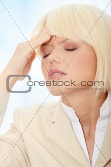 Young business woman with headache