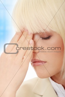 Young business woman with headache
