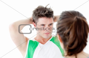 Good-looking man doing fitness exercises with a woman