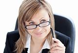 Charismatic businesswoman holding a pen wearing glasses