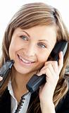 Attractive businesswoman talking on phone holding glasses 