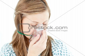 Depressed female patient with a mask