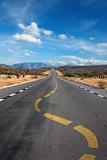 Twisting lane marking on road in desert