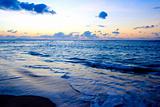 Calm ocean and beach on tropical sunrise