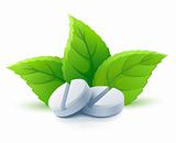 natural medical pills with green leaves