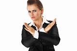 modern business woman with crossed arms. forbidden gesture