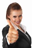 smiling modern business woman showing thumbs up gesture
