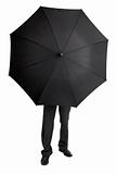 Man hid behind large black umbrella