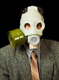 Portrait of person in a gas mask on black background