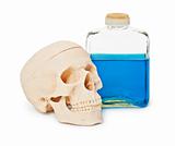 Still-life - bottle with blue poisonous liquid and human skull