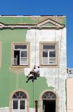 Painter hanged at a building´s façade