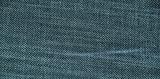 texture of blue jeans with thick interlacing of filaments 
