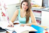 Captivating brunette student doing her homework