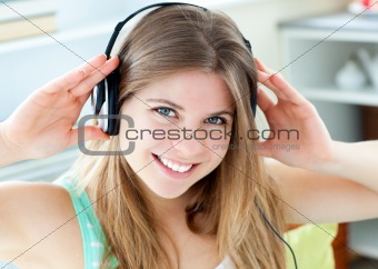Jolly caucasian woman listen to music with headphones