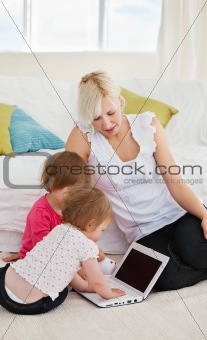 Small family having fun with a laptop 
