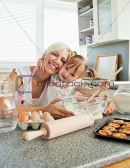 Laughing woman baking cookies with her daughter