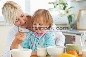  Mother having breakfast with her daughter