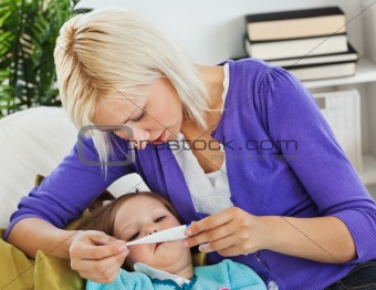Mother taking care of her sick child