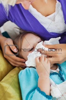 Mother taking care of her ill child