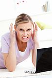 Aggressive young woman using her laptop 