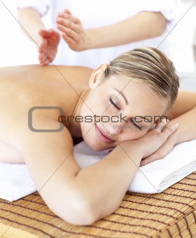 Attractive caucasian woman receiving a tapping massage 