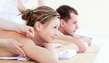 Attractive young couple having an acupunctre therapy