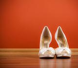 Bride's shoes on red background