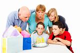 Family Blows Out Birthday Candles