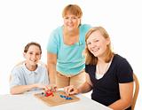 Family Plays Board Game
