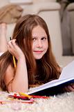 Closeup of cute little girl doing her homework