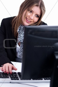 Smiling professional working with desktop at his desk
