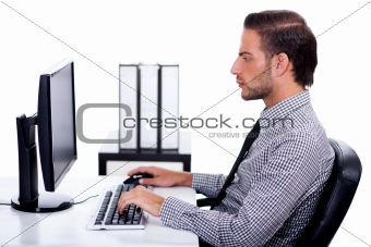 Business man verfying data on his computer
