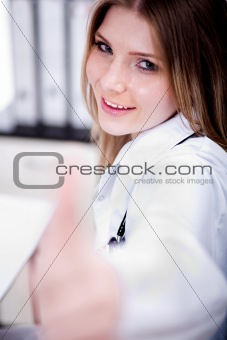 Female Doctor showing thumbs up sign