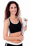Fitness woman holding a blank clip board