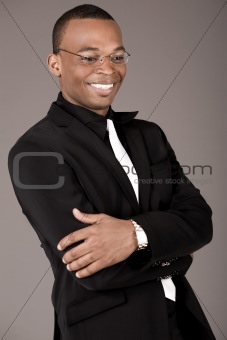 Happy young african business man laughing
