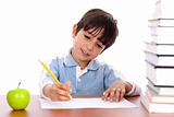 Cute young boy busy in drawing