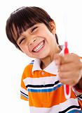 Happy young boy showing the toothbrush