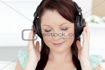 Relaxed young woman listen to music 