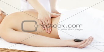 Resting young woman having a back massage 