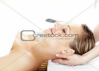 Glowing young woman  enjoying a massage 
