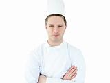 Attractive young chef  with folded arms 