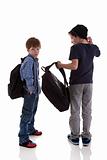 two students seen with his back to the school bags, one looking back