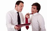 two businessmen discussing because of work, pointing to a document and pull the tie