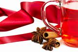 half red tea cinnamon sticks star anise and red ribbon