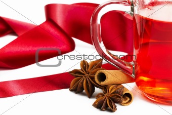half red tea cinnamon sticks star anise and red ribbon