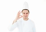 Handsome cook giving hand signal 
