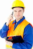 Smiling worker holding a clipboard talking on phone